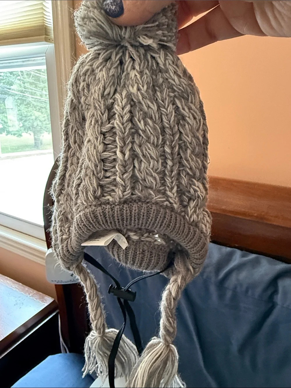 Gray knit winter hat for dogs with drawstrings